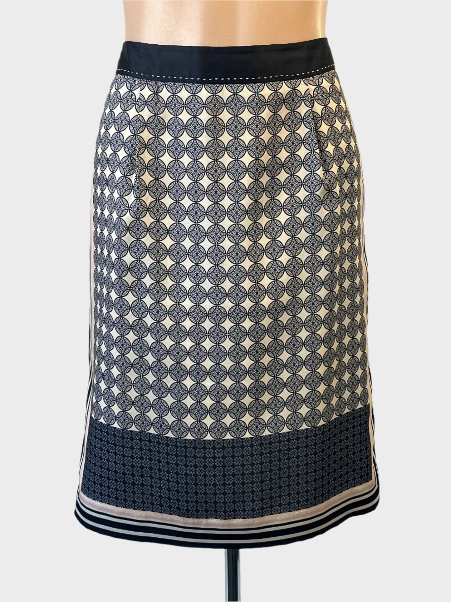 Designer Ann Taylor straight skirt in blue and white with geometric print and back vent for office or special events wear.