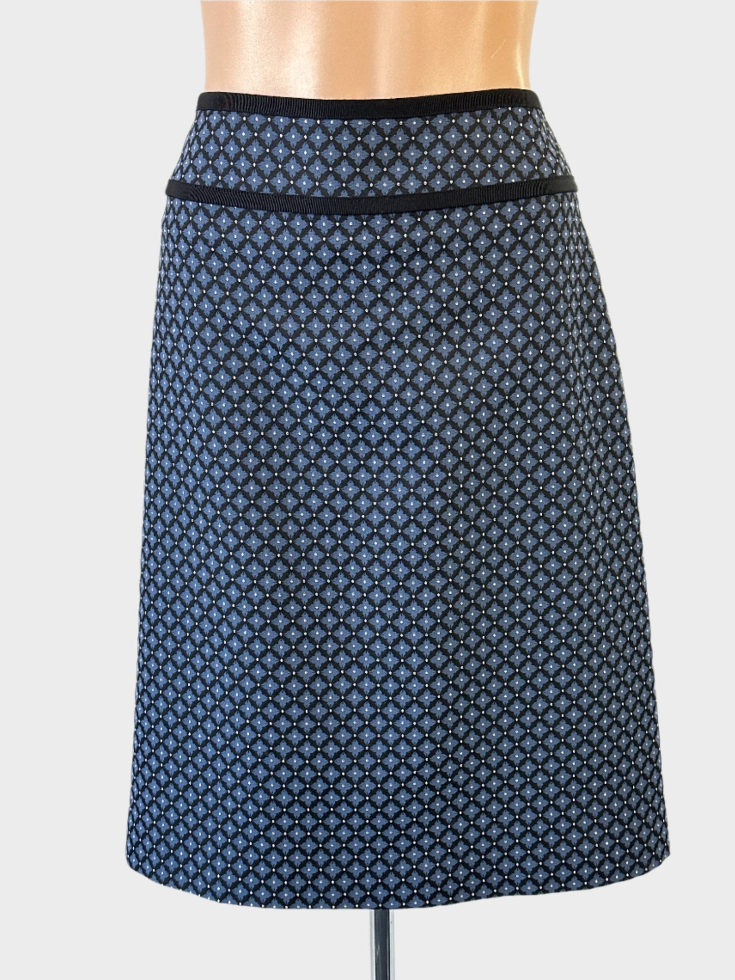 Designer Anna Thomas straight skirt in blue quatrefoil jacquard with yoke waist and contrasting grosgrain ribbon trim for office.