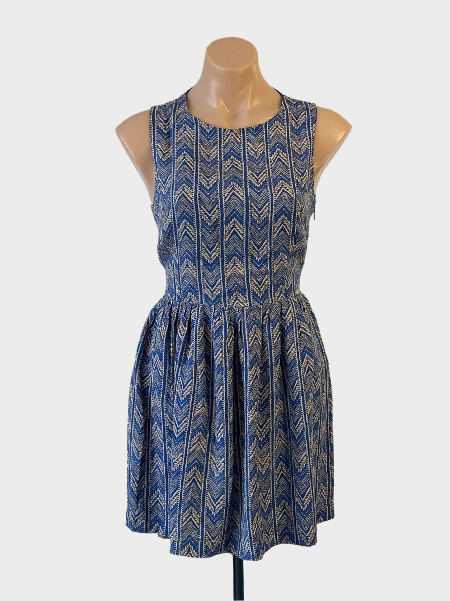 Bec + Bridge sleeveless A-line dress in blue and beige chevron stripe for smart casual or resort wear.
