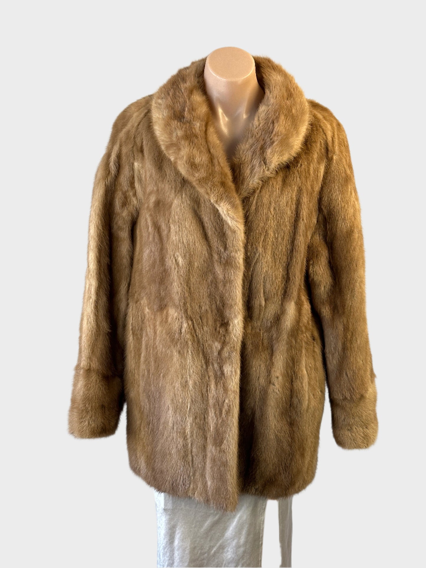Berkeley Furs vintage 80’s fur coat with shawl collar, in-seam pockets and hook & eye closure for formal or evening wear