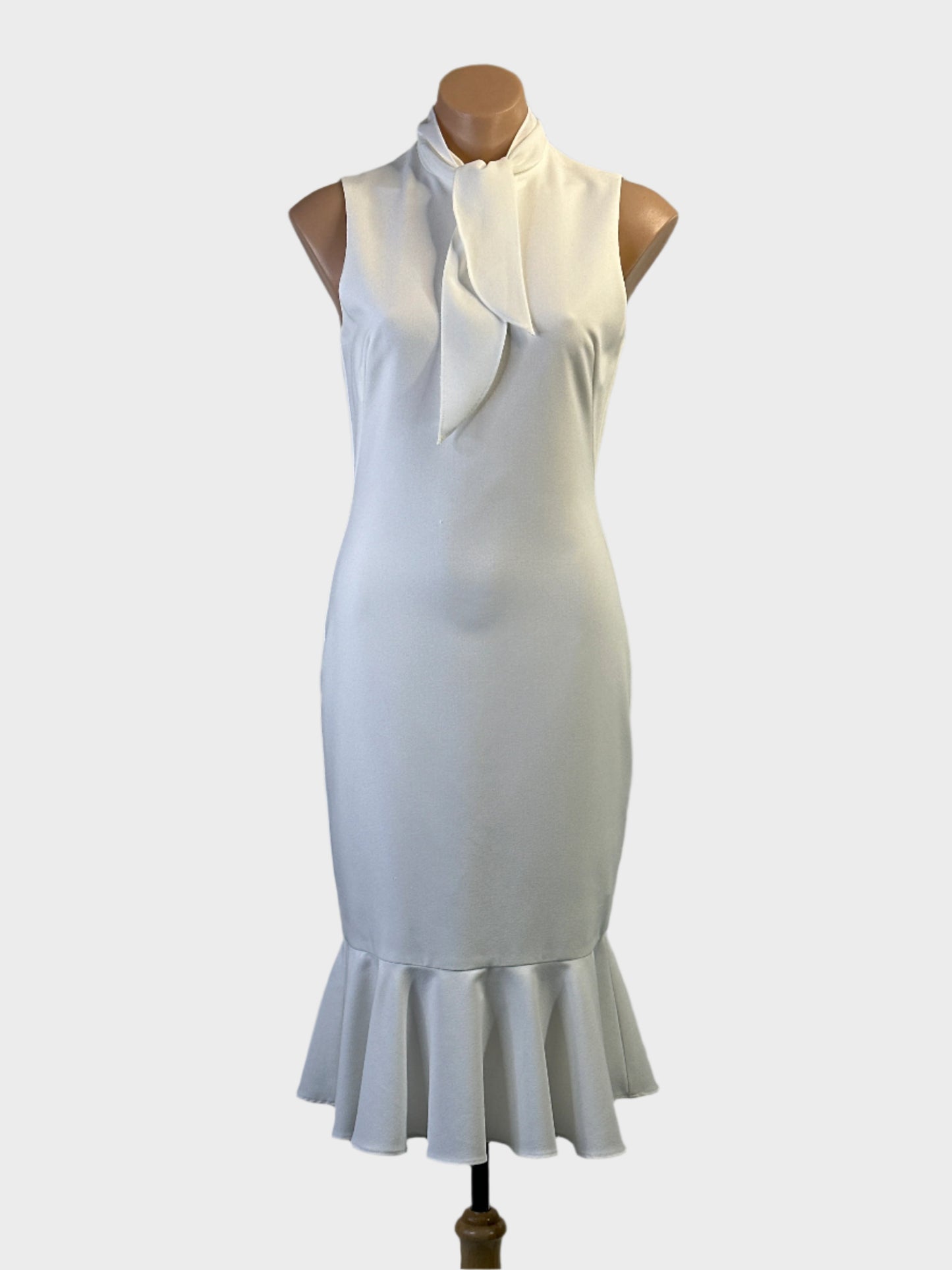 Black Halo midi sheath dress in white peach with square neck and pleated bodice for formal wear.
