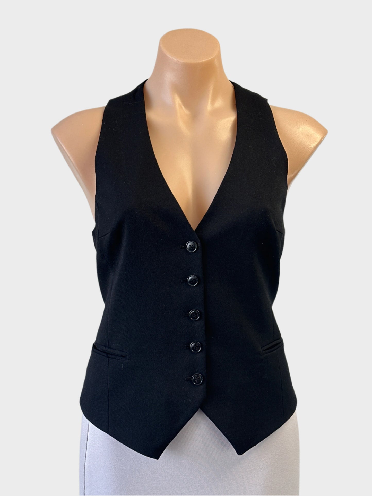 Classic tailored vest with v-neck, button closure and rear cinch for smart casual or office wear.