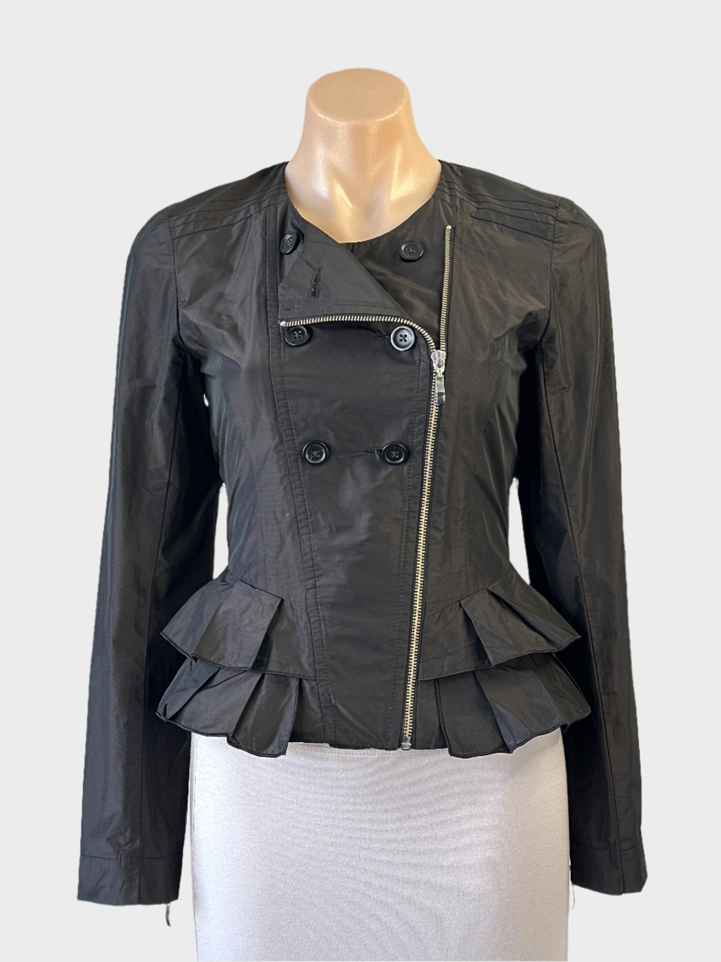 Cue retro 80’s black jacket with decorative buttons, exposed zip cuffs and tiered pleated peplum for evening wear