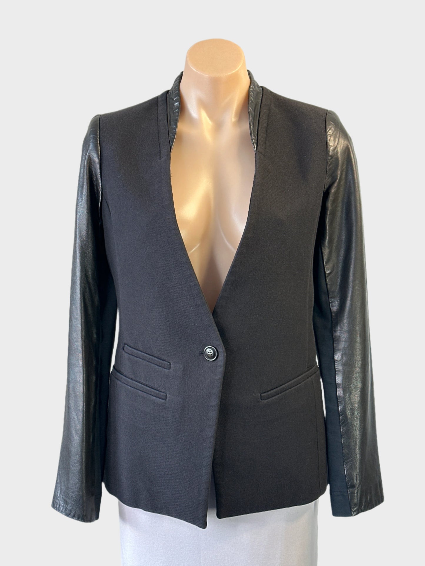 Designer Arthur Galan black cotton wool jacket with leather sleeves and band collar for smart casual or office wear.