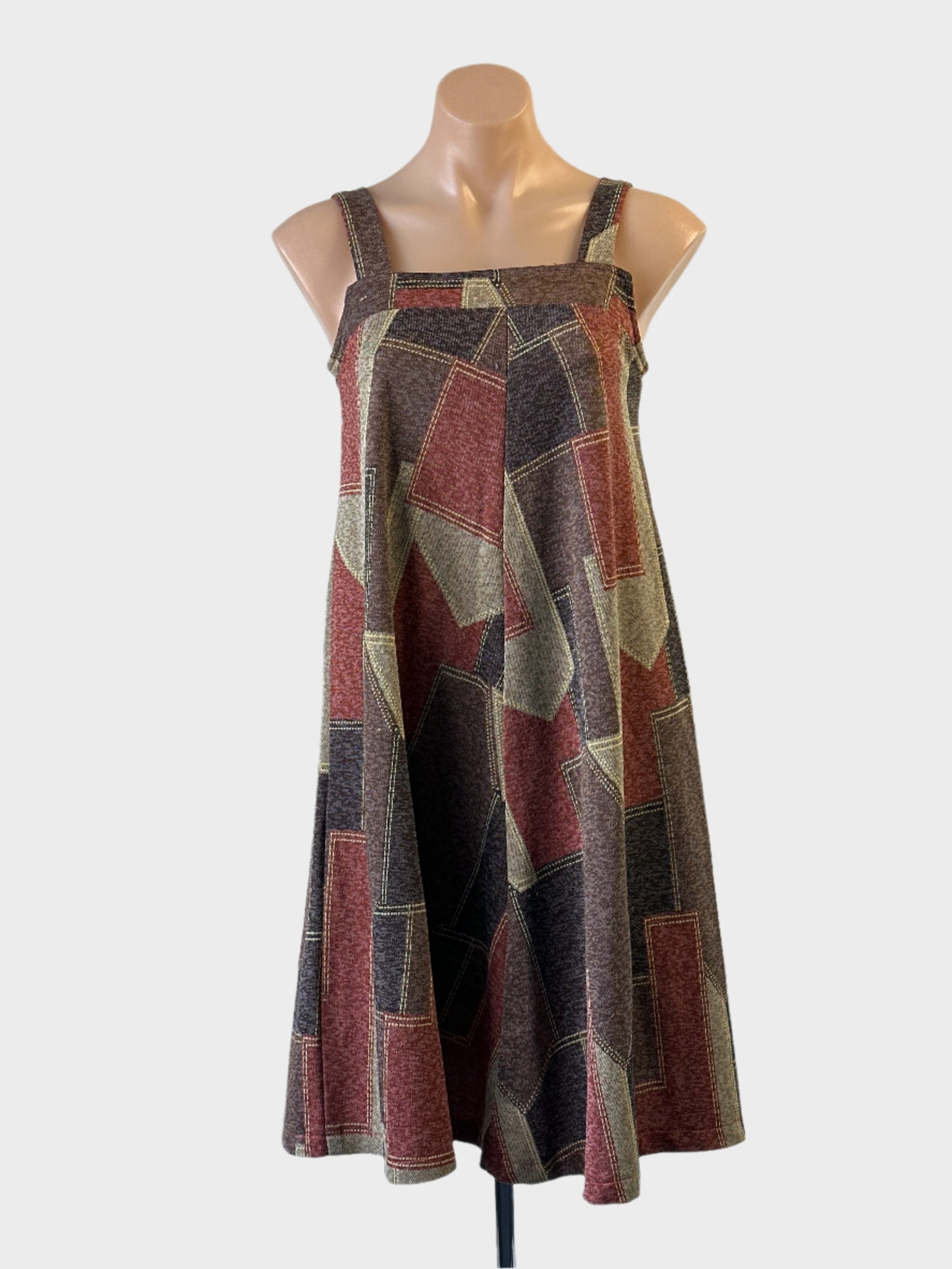 Designer Eclipse Creations apron dress in brown and red patchwork print with flared skirt for smart casual or office wear.