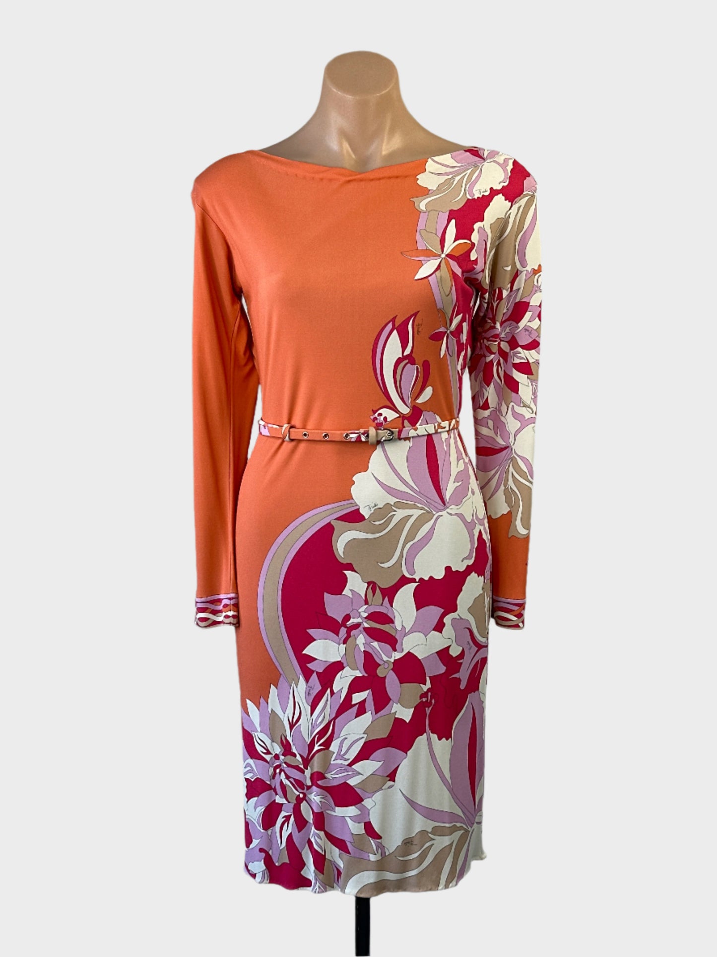 Designer Emilio Pucci knee length dress in orange with a floral print, bateau neck and skinny belt for office or special events.