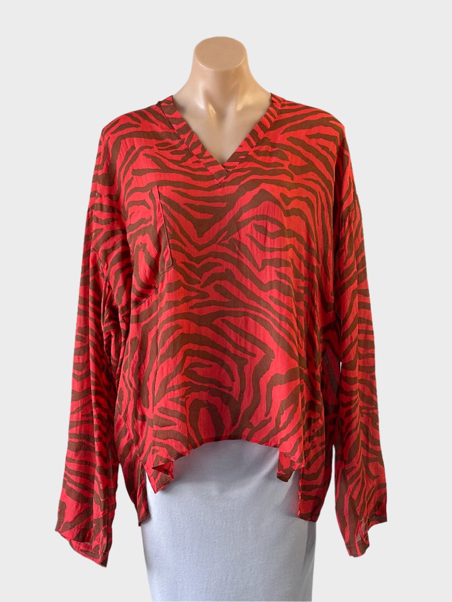 Designer Funky Staff top in orange and brown zebra print with v-neck and high low hem for smart casual or evening wear.