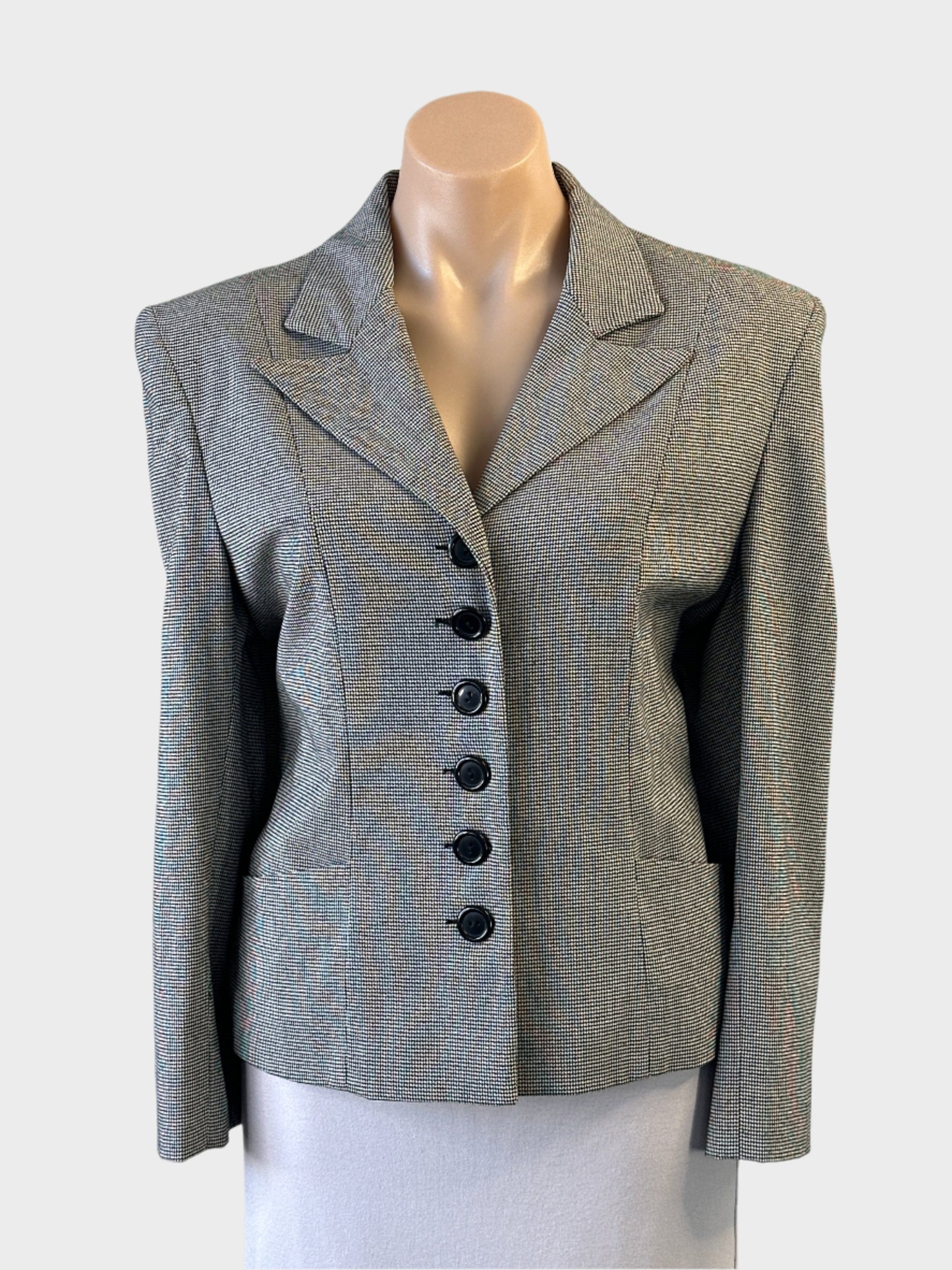I.Q. Trademark single breasted jacket in black and white houndstooth with six button closure for office wear.