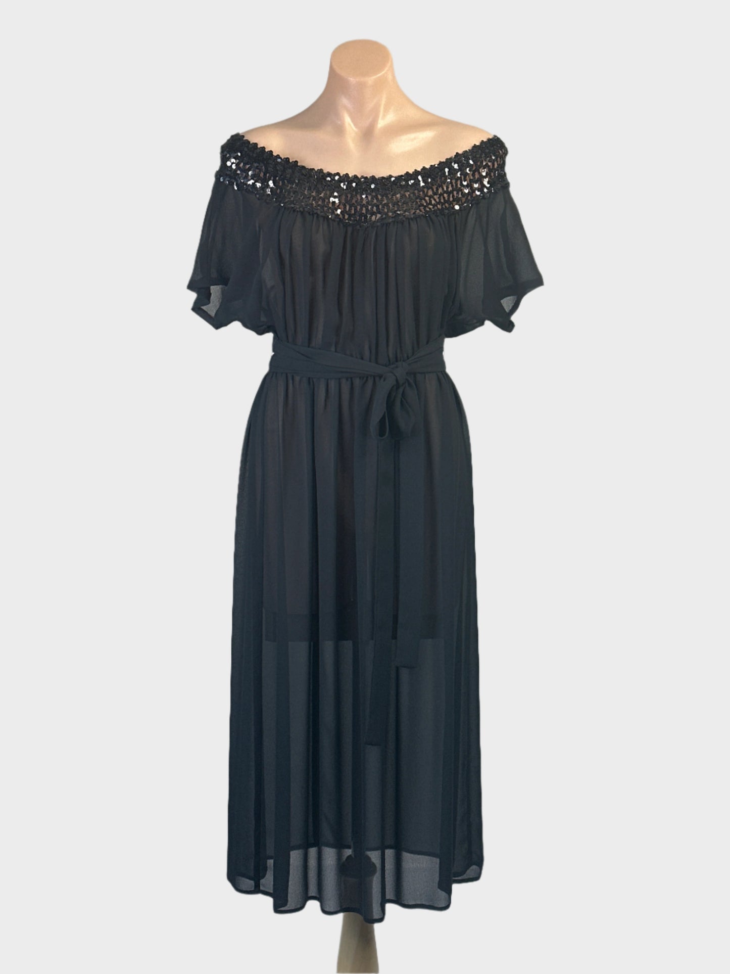 Vintage 70’s black off the shoulder chiffon dress with sequinned neckband and gathered skirt for evening wear.