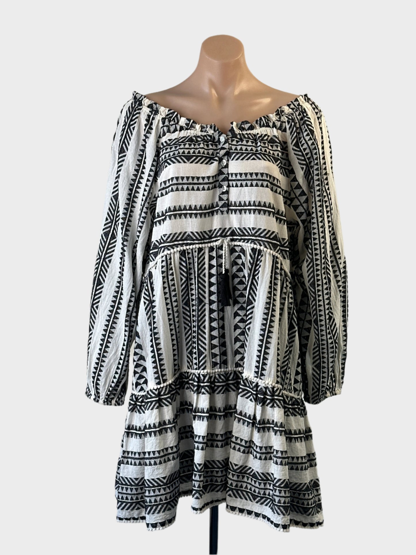 Next black and white boho smock dress in striped weave with pompom trim for resort or smart casual wear.