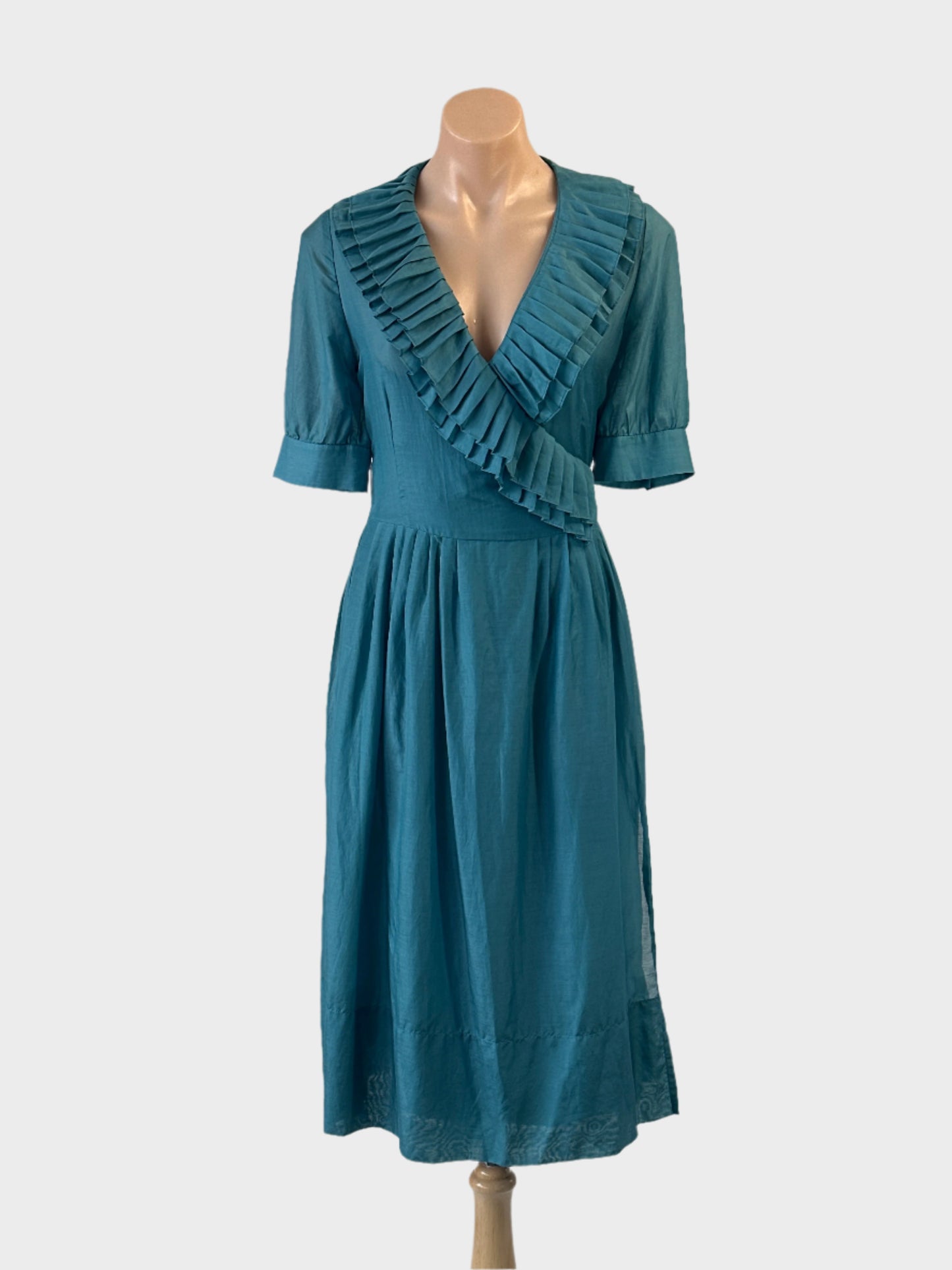 Designer Perri Cutten wrap dress in blue with frilled collar and waist sash for smart casual or special events wear.
