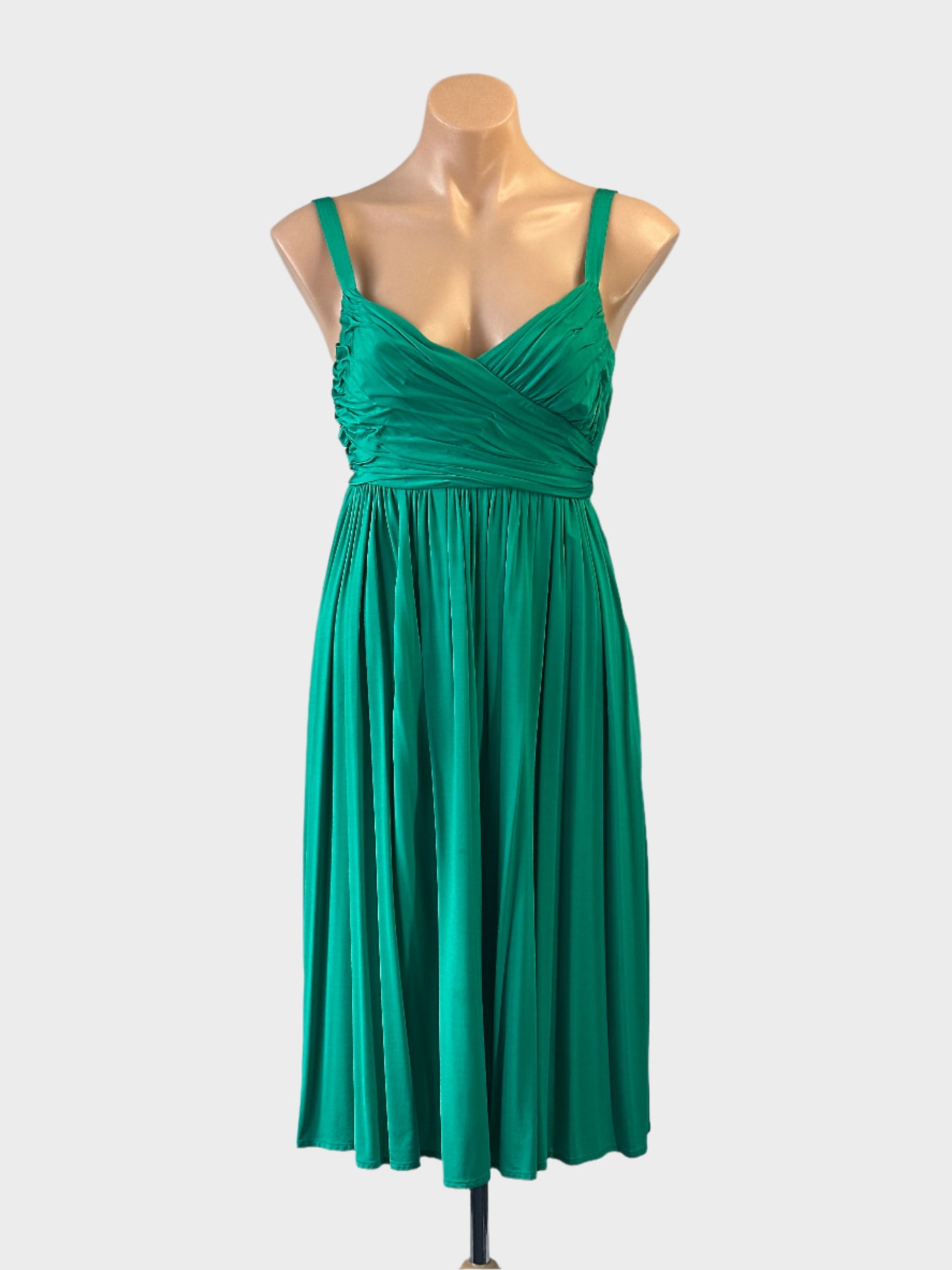 Designer SABA empire waist dress in green with pleated surplice neck and gathered skirt for smart casual or special events wear.