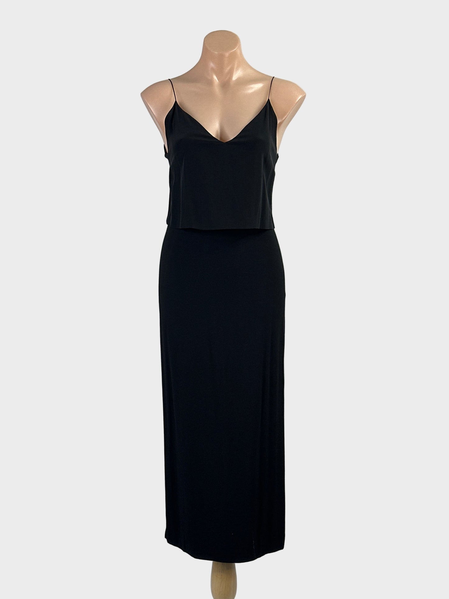 Designer Sandro black sleeveless maxi gown with overlay top, v-neck and straight skirt with side slits for formal or evening wear.