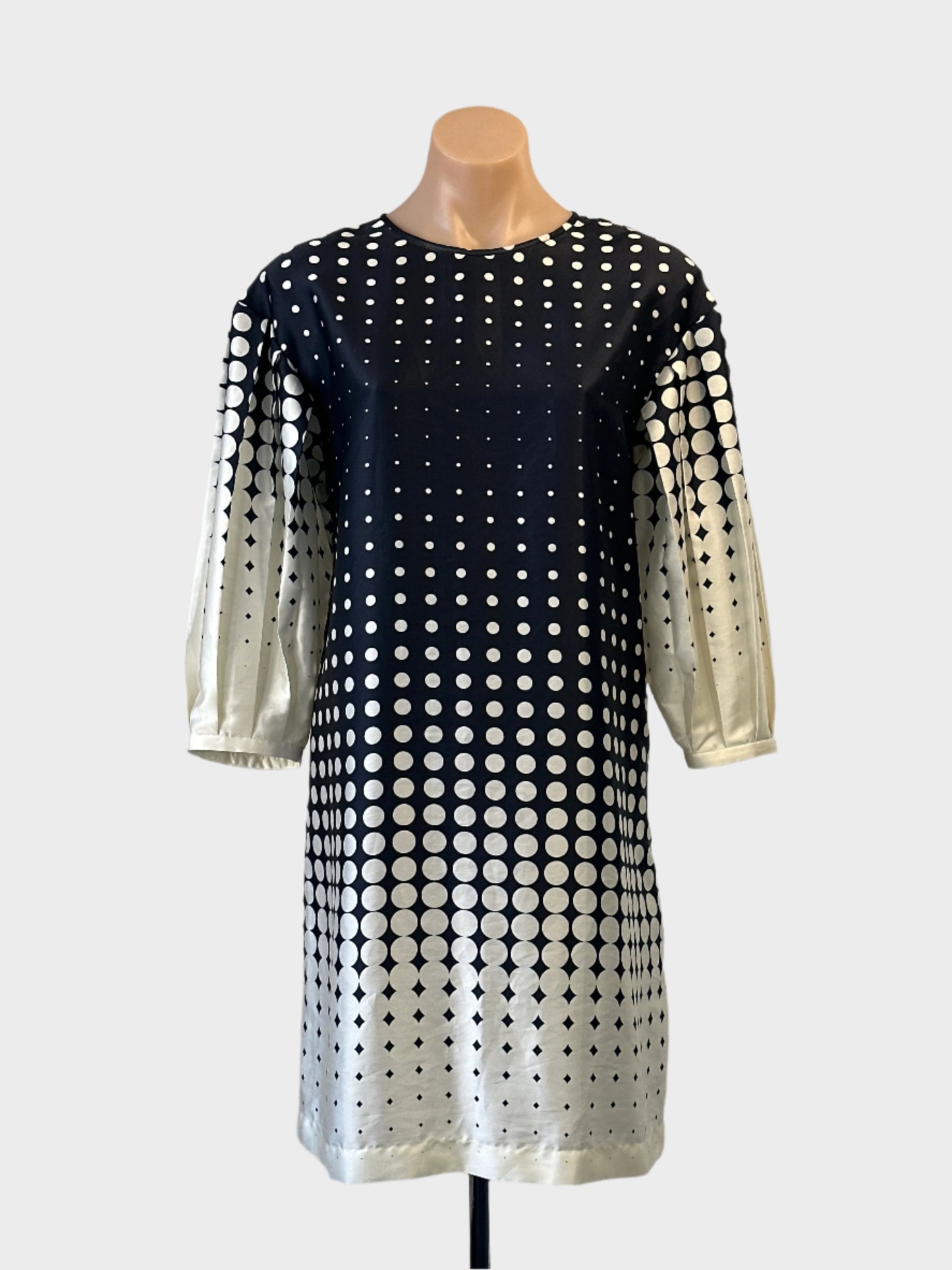 Veronika Maine shift dress in navy blue and cream dot print with balloon sleeves for office or special events wear.