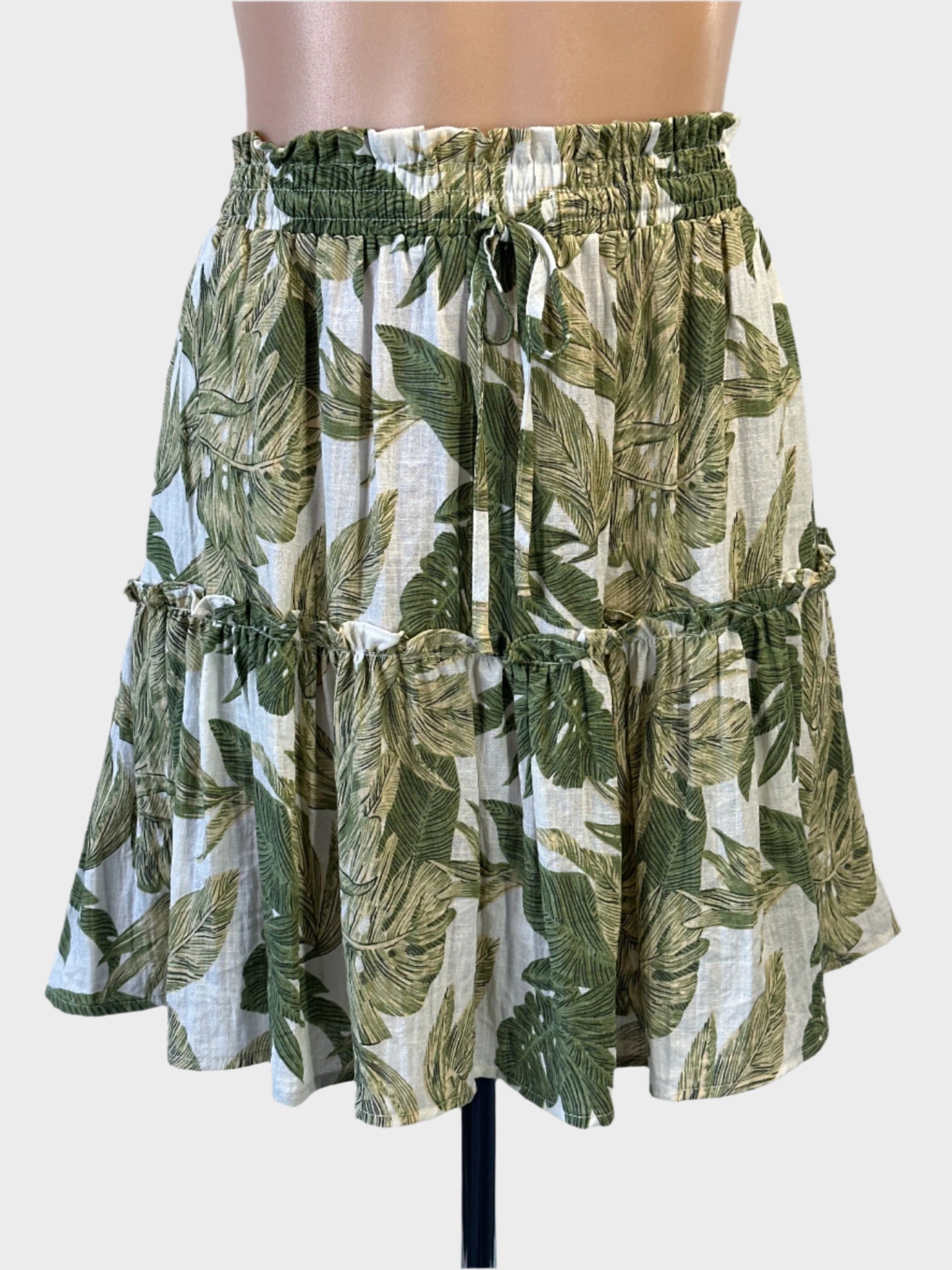 Yours Truly tropical style tiered skirt in green and white botanical print with drawstring waistband for resort or smart casual wear.