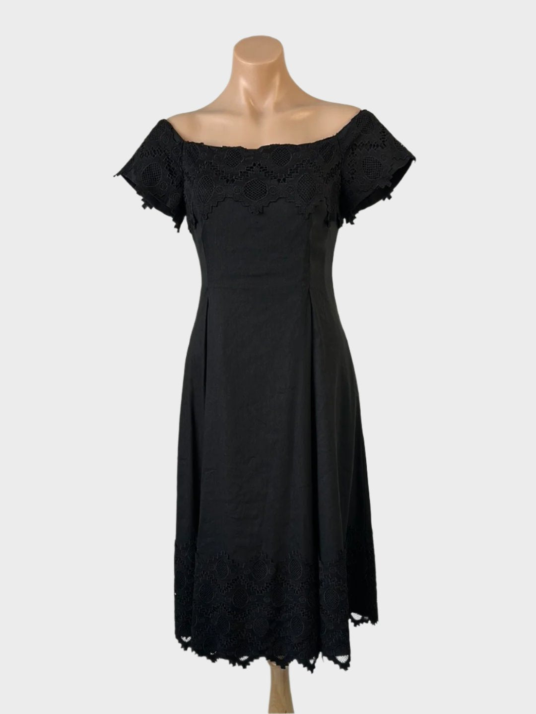 Country Road off the shoulder black dress in linen blend with guipure lace flounce neck, cap sleeves, and pleated skirt for smart casual wear.