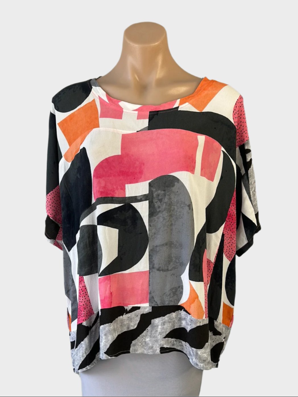 Designer Foil retro 80's oversized top in pink and white print with scoop neck, dolman sleeves, and contrasting hem for smart casual wear."