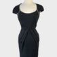 Natasha Gan retro 50's sheath dress in black with piped trim, D-shaped neck, cap sleeves, and pleated pencil skirt with slash pockets for office or evening wear.