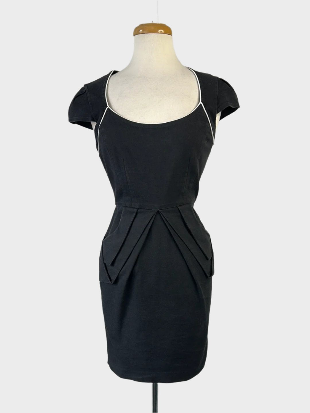 Natasha Gan retro 50's sheath dress in black with piped trim, D-shaped neck, cap sleeves, and pleated pencil skirt with slash pockets for office or evening wear.