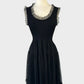 Alannah Hill black sleeveless knit dress with floral appliqué, frilled tulle trim, u-shaped neck, and tiered tulle skirt for evening wear.