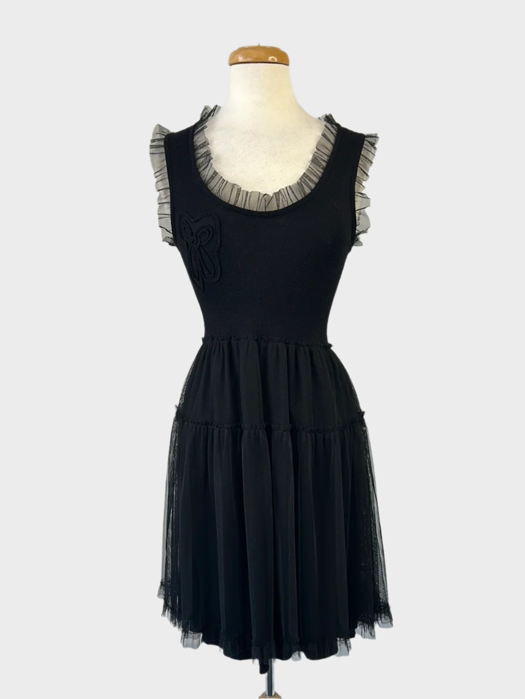 Alannah Hill black sleeveless knit dress with floral appliqué, frilled tulle trim, u-shaped neck, and tiered tulle skirt for evening wear.