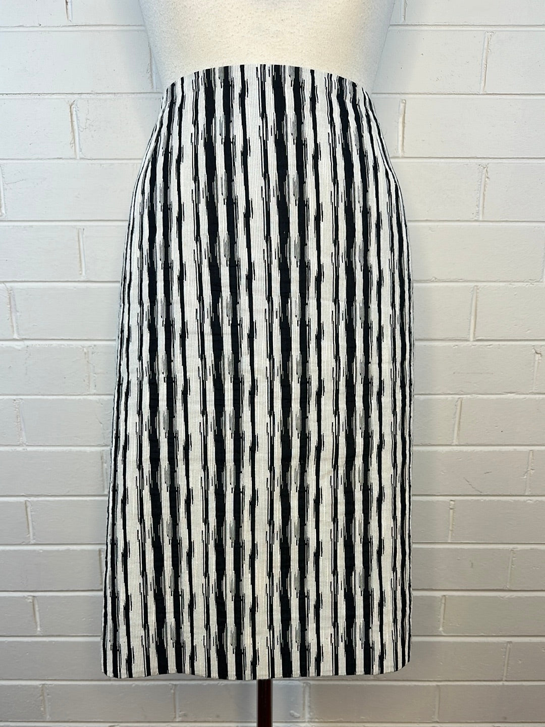 Knee length black outlet and white striped skirt