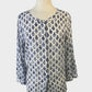 Designer Anna Thomas shirt with blue and white woodblock print, scoop neck, button front, three-quarter sleeves, and yoke back for smart casual.