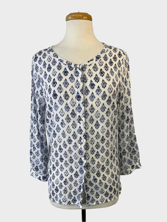 Designer Anna Thomas shirt with blue and white woodblock print, scoop neck, button front, three-quarter sleeves, and yoke back for smart casual.