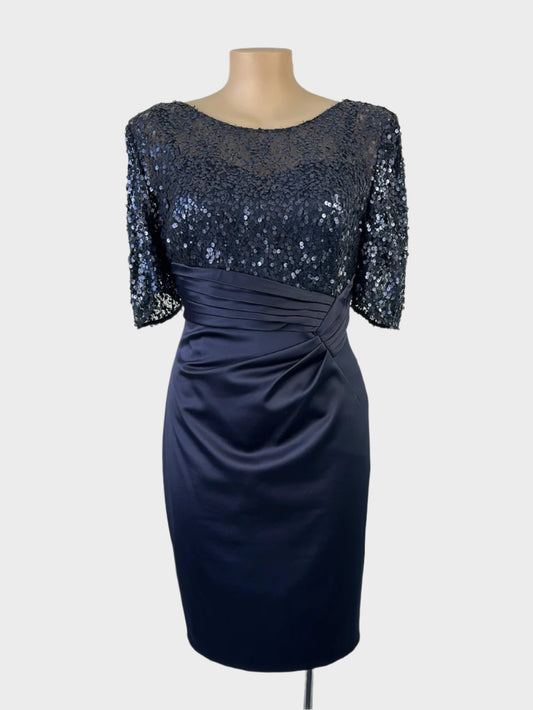 Designer Anthea Crawford sheath dress in blue satin with sequin overlay, illusion neck, ruched waist, and back vent for formal wear.