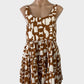 Designer Mister Zimi sleeveless smock dress in brown & white cotton-linen with retro geometric print, u-shaped neck, gathered waist, and tiered skirt for smart casual or resort.