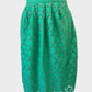 Boden pleated skirt in green guipure lace with daisy pattern, contrasting lining, waistband, and scalloped hem for office wear.