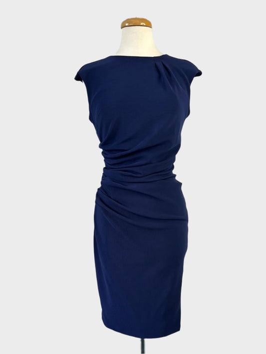 Diva retro 60's sleeveless sheath dress in navy blue rib jersey with pleated neck, drop shoulders, ruched waist, and pencil skirt for party or evening.