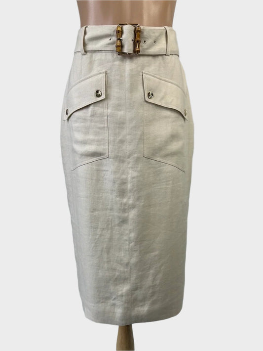 Witchery safari style straight skirt in beige linen with wide waistband, bamboo buckle, flap pockets, and back vent for office wear.