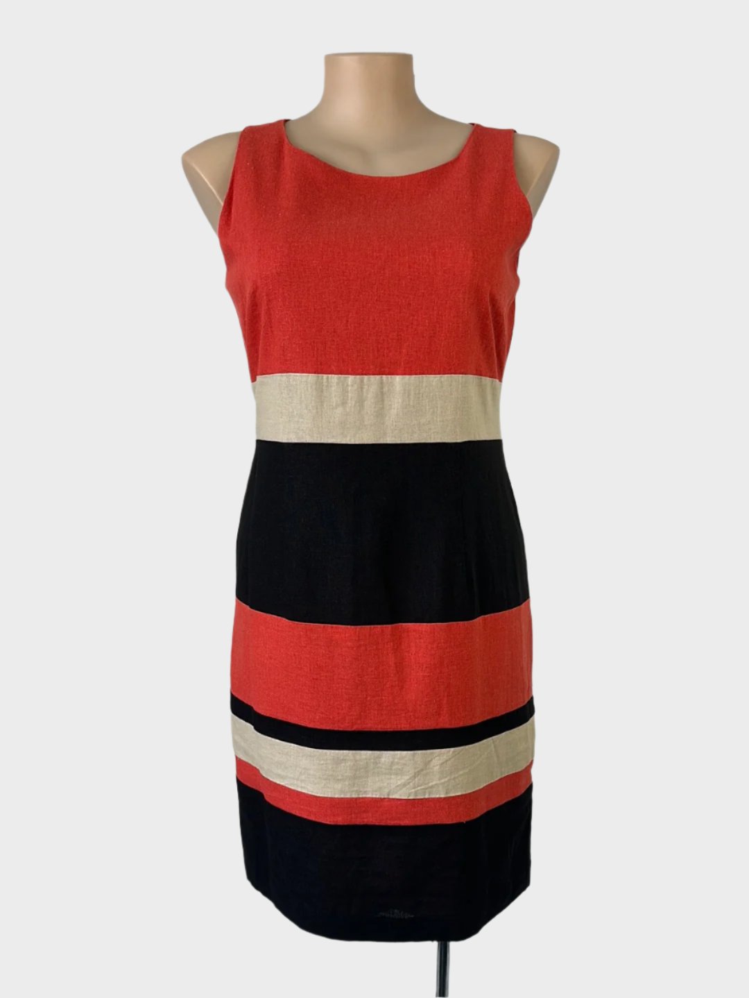 Queenspark sleeveless shift dress in orange and navy striped panels with bateau neck and skirt with back vent for office or smart casual wear.