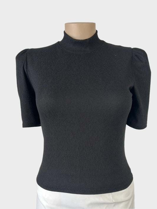 Seed top in black textured jersey with a band collar, short gathered sleeves, and back zip closure, suitable for office or smart casual wear.