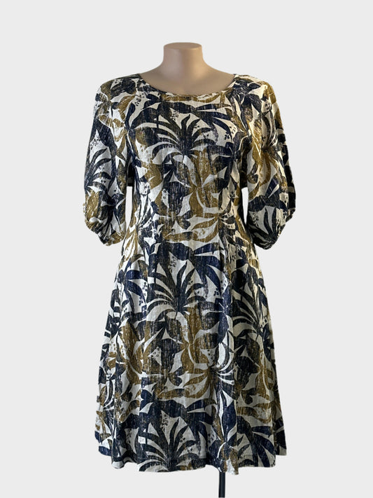 Regatta blue and khaki princess line dress in botanical print linen with pintuck waist for resort or smart casual wear.