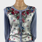 Australian designer Alannah Hill cardigan in knit with floral print panel, ruffle bib, crystal buttons, and rib trim for smart casual or office wear.