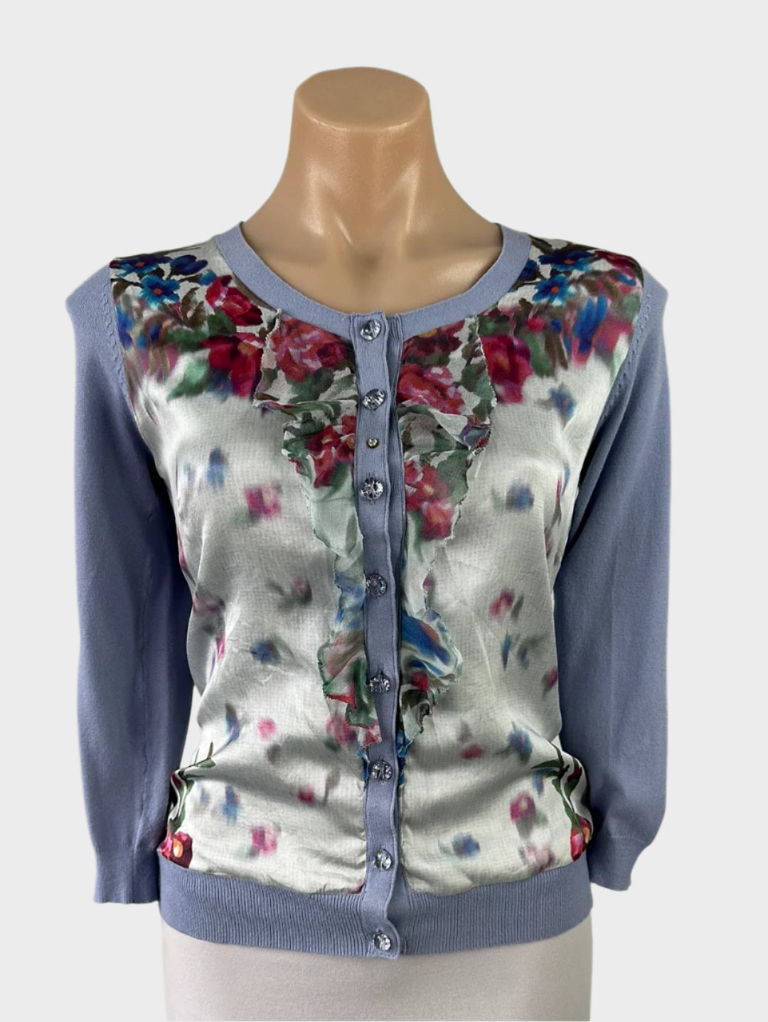 Australian designer Alannah Hill cardigan in knit with floral print panel, ruffle bib, crystal buttons, and rib trim for smart casual or office wear.