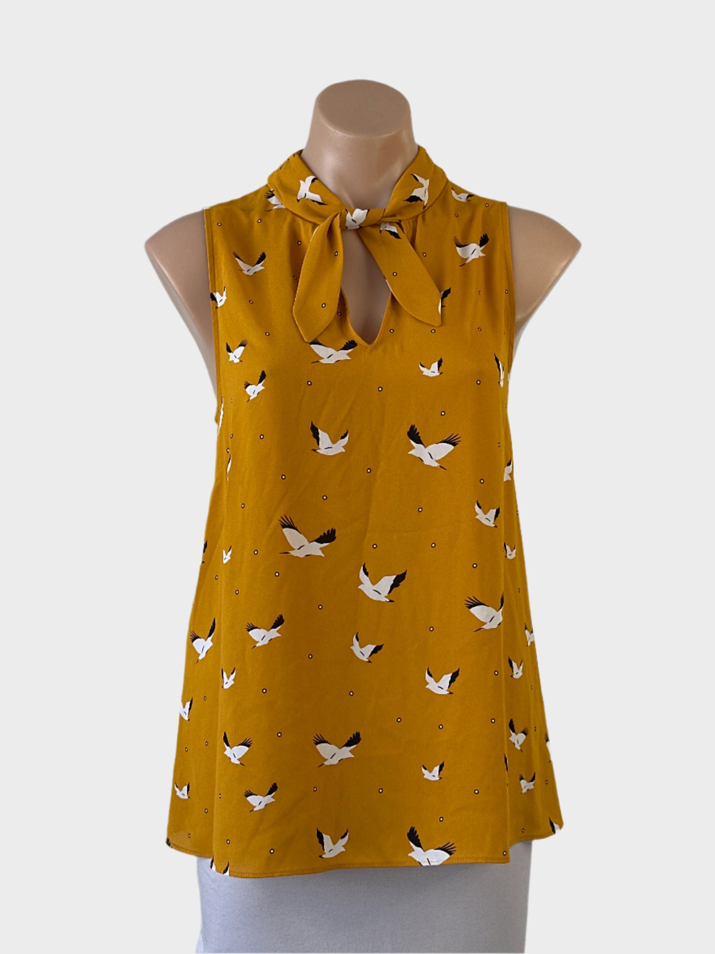 cue-sleeveless-top-yellow-polka-dot-cranes-keyhole-neck