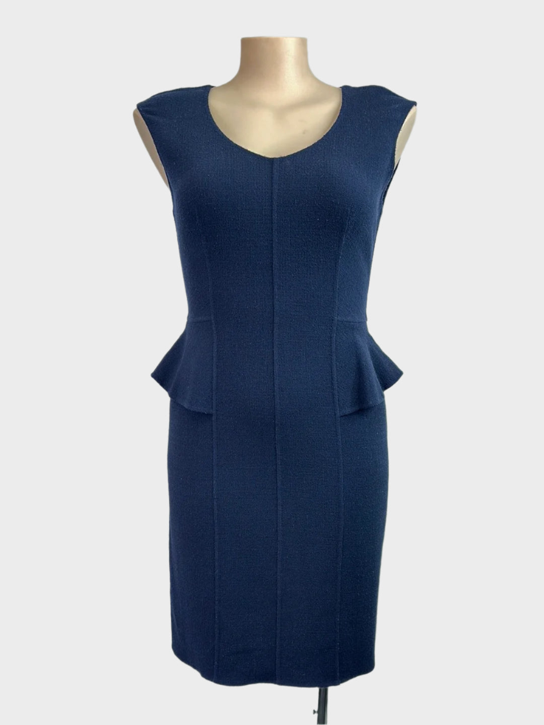 Designer Armani navy blue sheath dress in textured wool jersey with raised seams, v-neck, half peplum waist, and straight skirt for office wear.