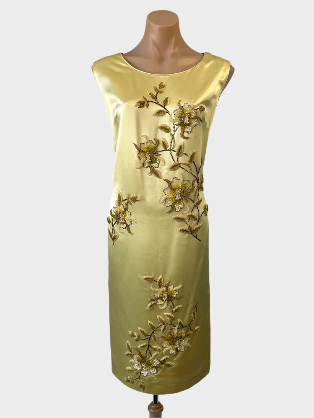 Vintage 60's sleeveless shift dress in gold satin with hand beaded floral motifs, bateau neck, and back vent for evening or formal wear.