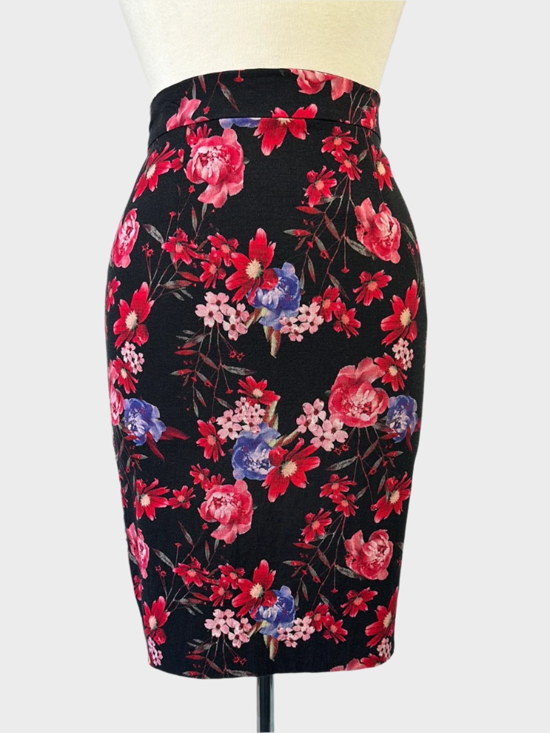 Alannah Hill designer straight skirt in dark floral print, knee-length with back vent, for party or workwear.