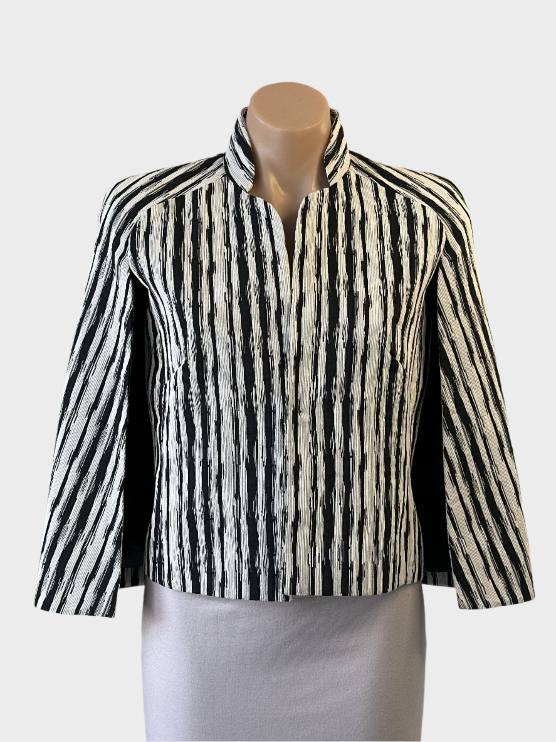 Designer Carla Zampatti capelet jacket in monochrome abstract stripe with open front, mandarin collar and cape back for office wear.