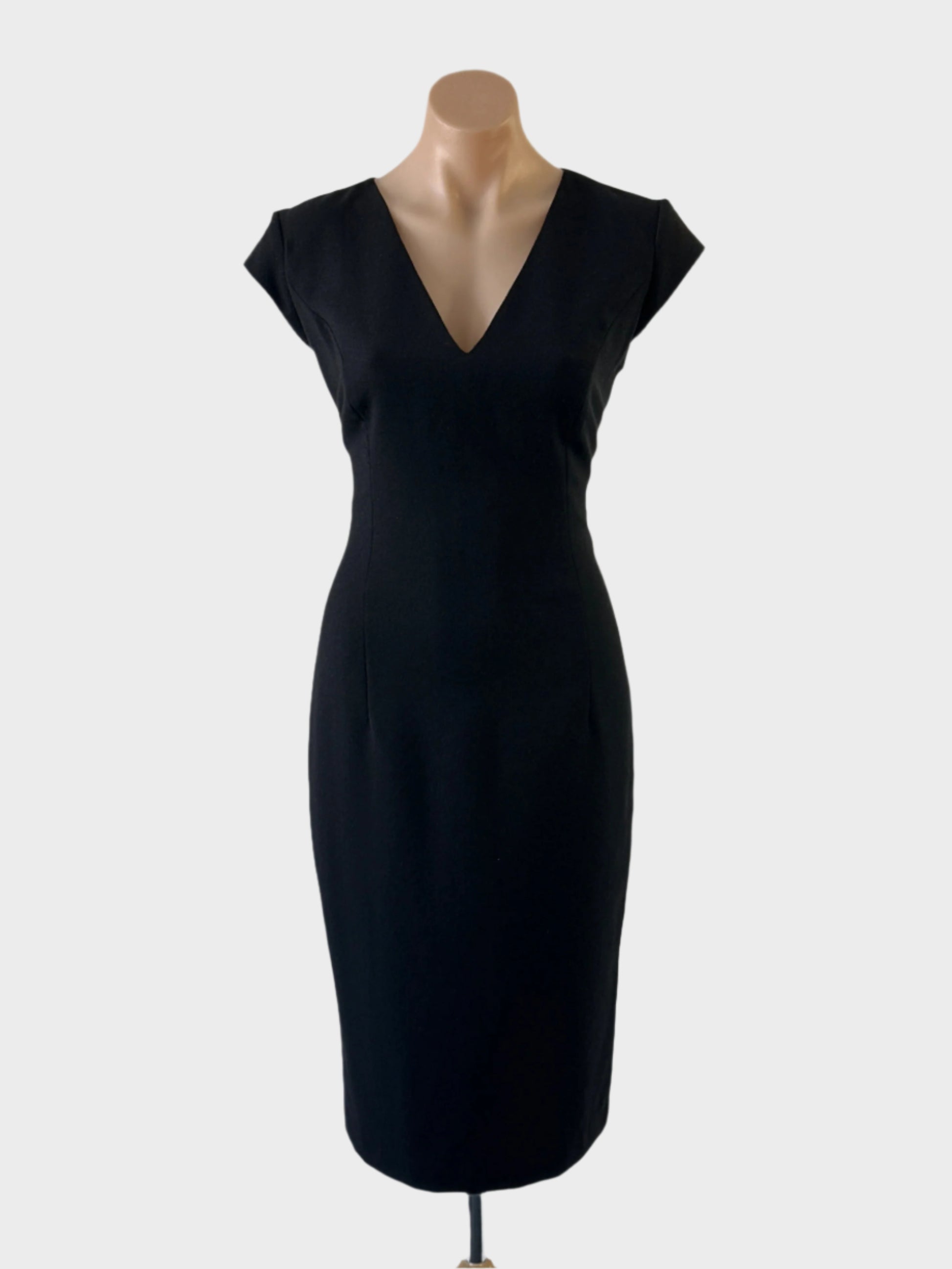 Designer Carla Zampatti classic shift dress in black pure wool crepe, featuring cap sleeves, v-neck, and straight skirt with back vent for office or evening occasions.