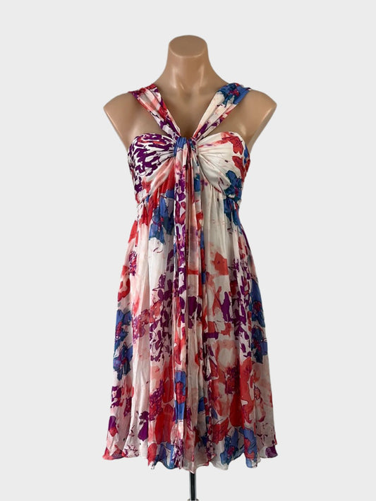 David Lawrence sleeveless empire waist dress in sheer silk chiffon with watercolor floral print, ruched bodice, draped sash, and circle skirt for special events.