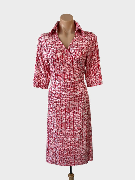 Designer Diane von Furstenberg wrap dress in pure silk jersey with red and white print, surplice neck, and straight skirt for office wear."