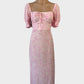 Faithful the Brand off-the-shoulder dress with pink pastel daisy print, puff sleeves, elasticated neck, and flared skirt for smart casual wear.