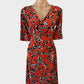 Designer Gerry Webber jersey dress with orange animal print, surplice neck, ruched waist, and straight skirt for smart casual or office wear.