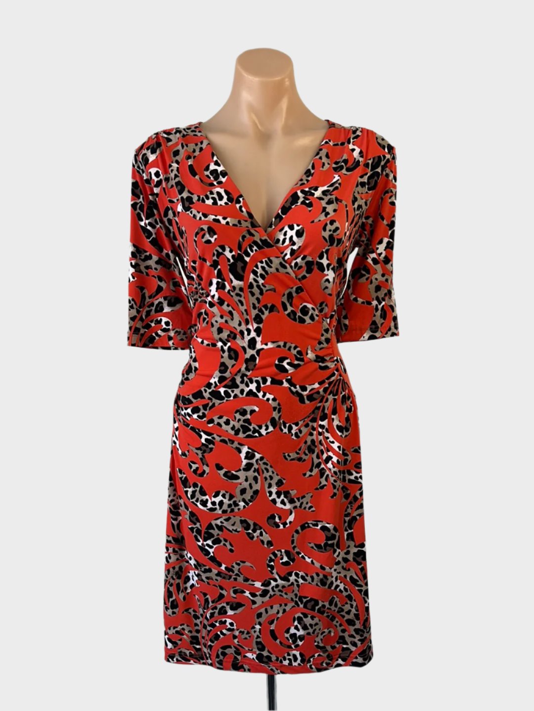 Designer Gerry Webber jersey dress with orange animal print, surplice neck, ruched waist, and straight skirt for smart casual or office wear.