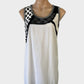 HEMPEL sleeveless shift dress in black & white cotton with polka dot, lace, and sequin panels, U-shaped neck, and rib trim for smart casual wear.